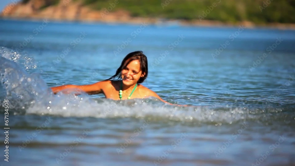 Cheerful brunette young woman in the sea water splashes. Koh Cheerful brunette young woman in the sea water splashes. Koh