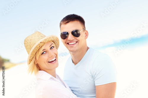 Portrait of a happy couple at the beach