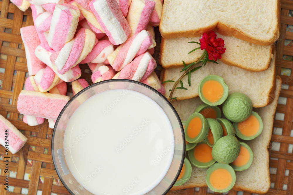 fresh milk and pink marshmallows with a slice of bread.