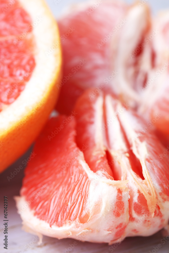 Ripe grapefruits on cutting board, on wooden background Ripe grapefruits on cutting board, on wooden background