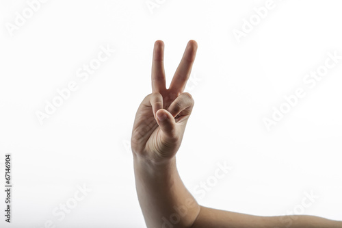 Obraz na plátně Young hand make 2 fingers gesture