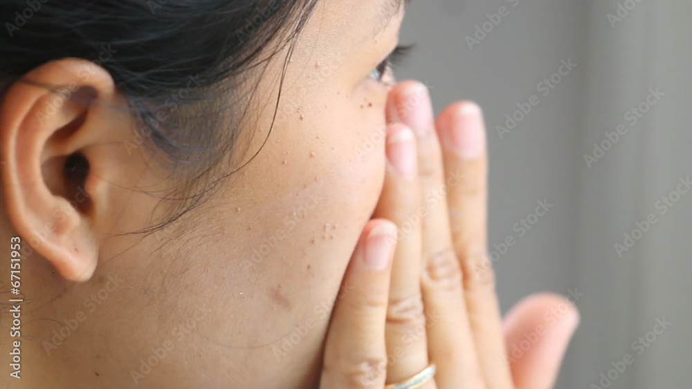woman applying make up by cream foundation woman applying make up by cream foundation