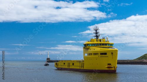 Yellow Platform Supply Ship and Pilot