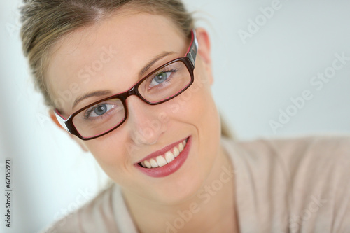 Beautiful smiling woman with eyeglasses on