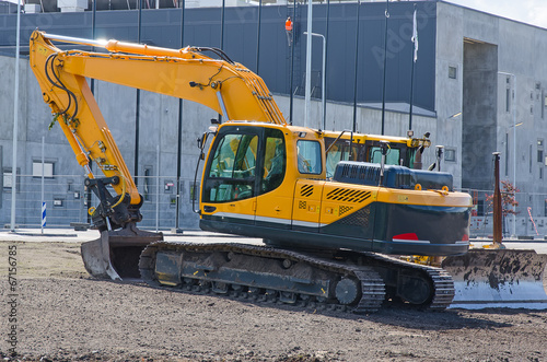 Excavator and bulldozer on construction site.