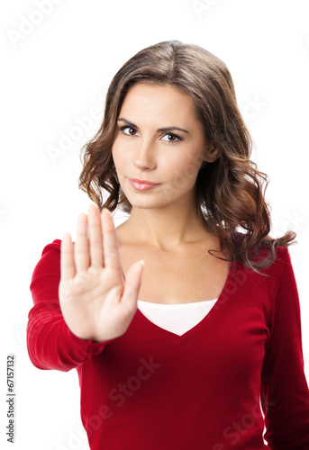 Serious woman with stop gesture, isolated