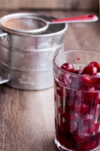 Wallpaper Mural fresh pitted cherries in a glass, steel cup Torontodigital.ca