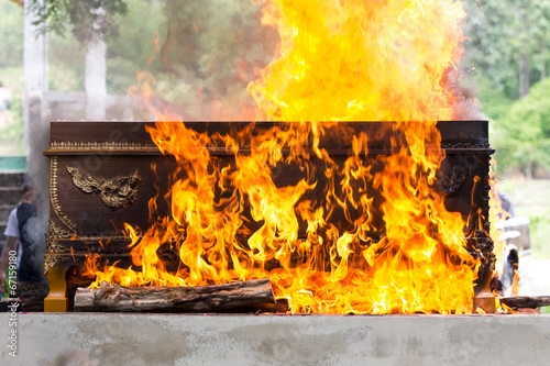 cremation at graveyard in thailand, coffin burning.