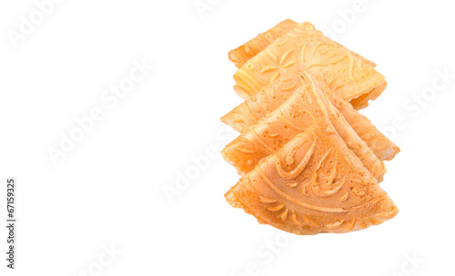 Kuih Kapit or the Chinese Love Letter biscuit over white photo