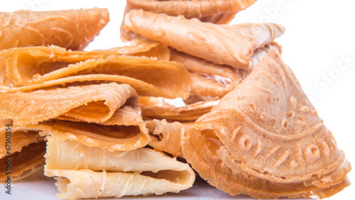 Kuih Kapit or the  Chinese Love Letter biscuit over white  photo