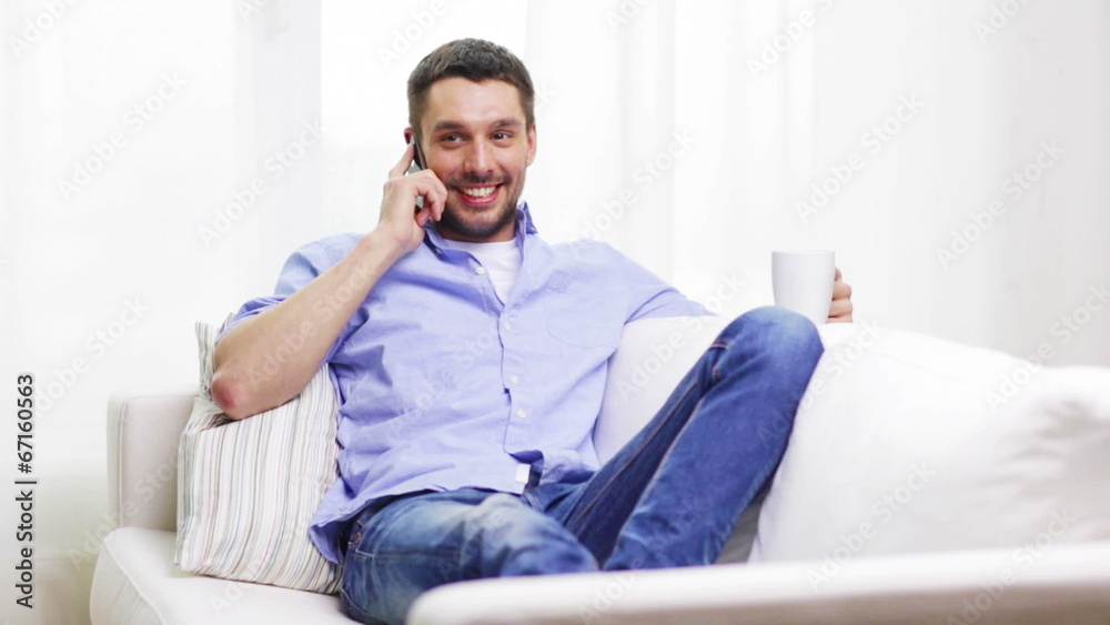 laughing man with smartphone at home laughing man with smartphone at home