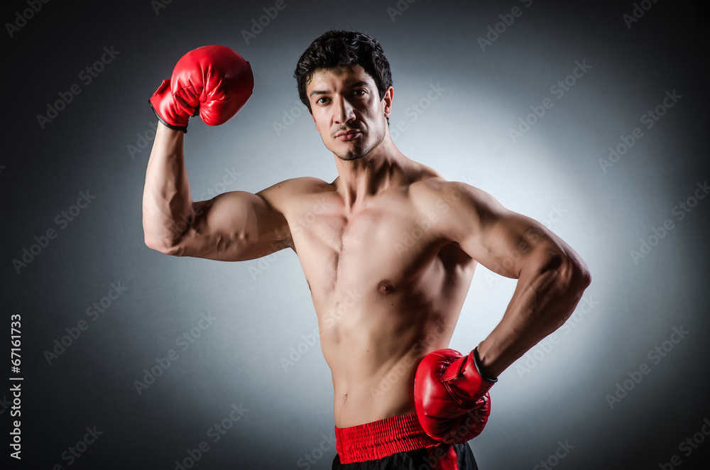Muscular boxer wiith red gloves Muscular boxer wiith red gloves