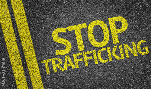 Stop Trafficking written on the road