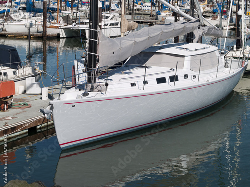 Sailboat Tied Up at Dock in Marina