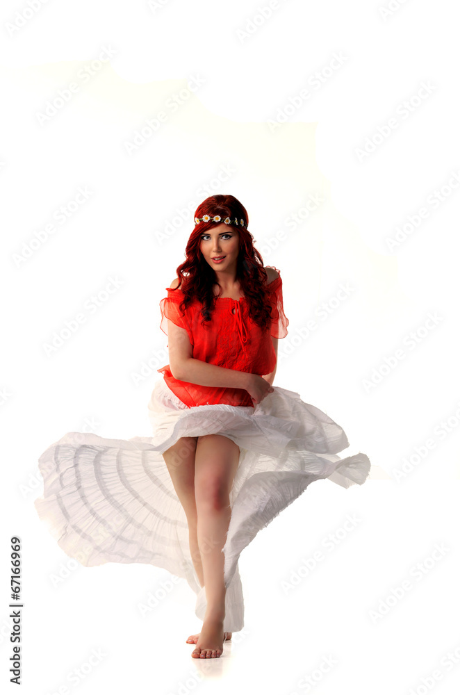 Naklejka premium young redhead dancer in ethnic costume