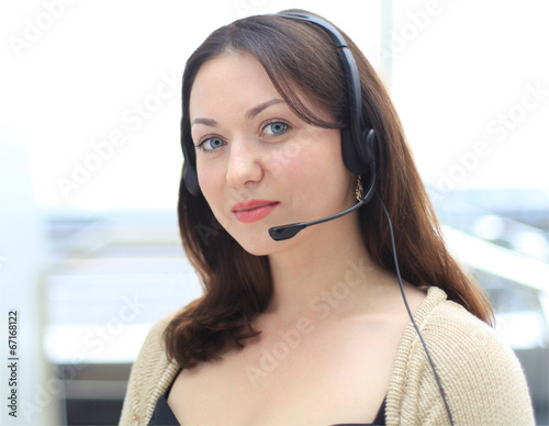 Beautiful young female call center operator