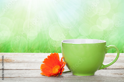 Fototapeta Naklejka Na Ścianę i Meble -  Cup of coffee and gerbera on wooden table