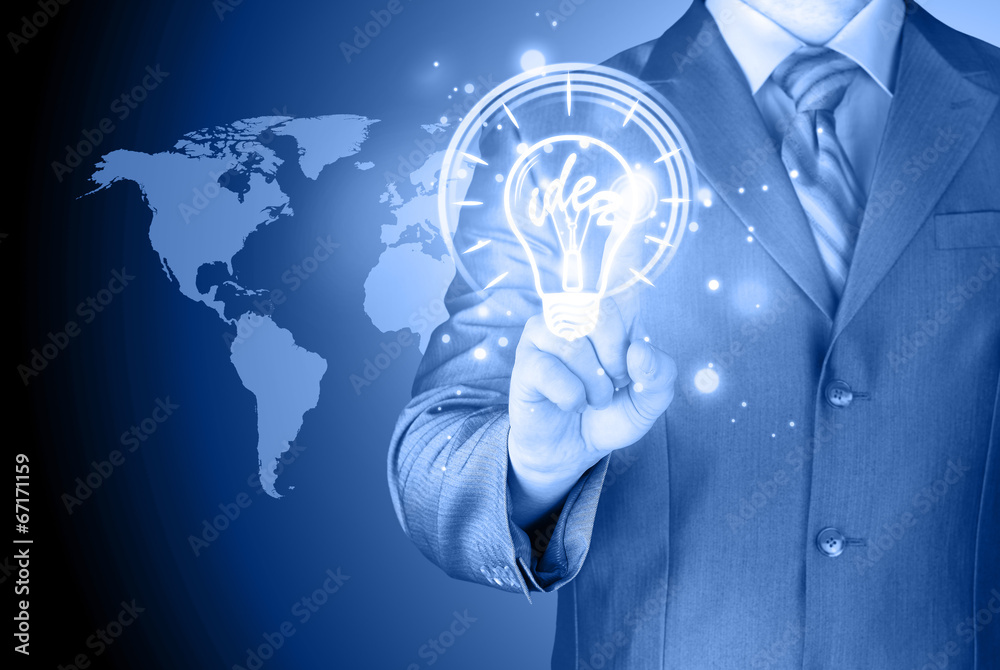 Fototapeta premium Business man touching light of idea