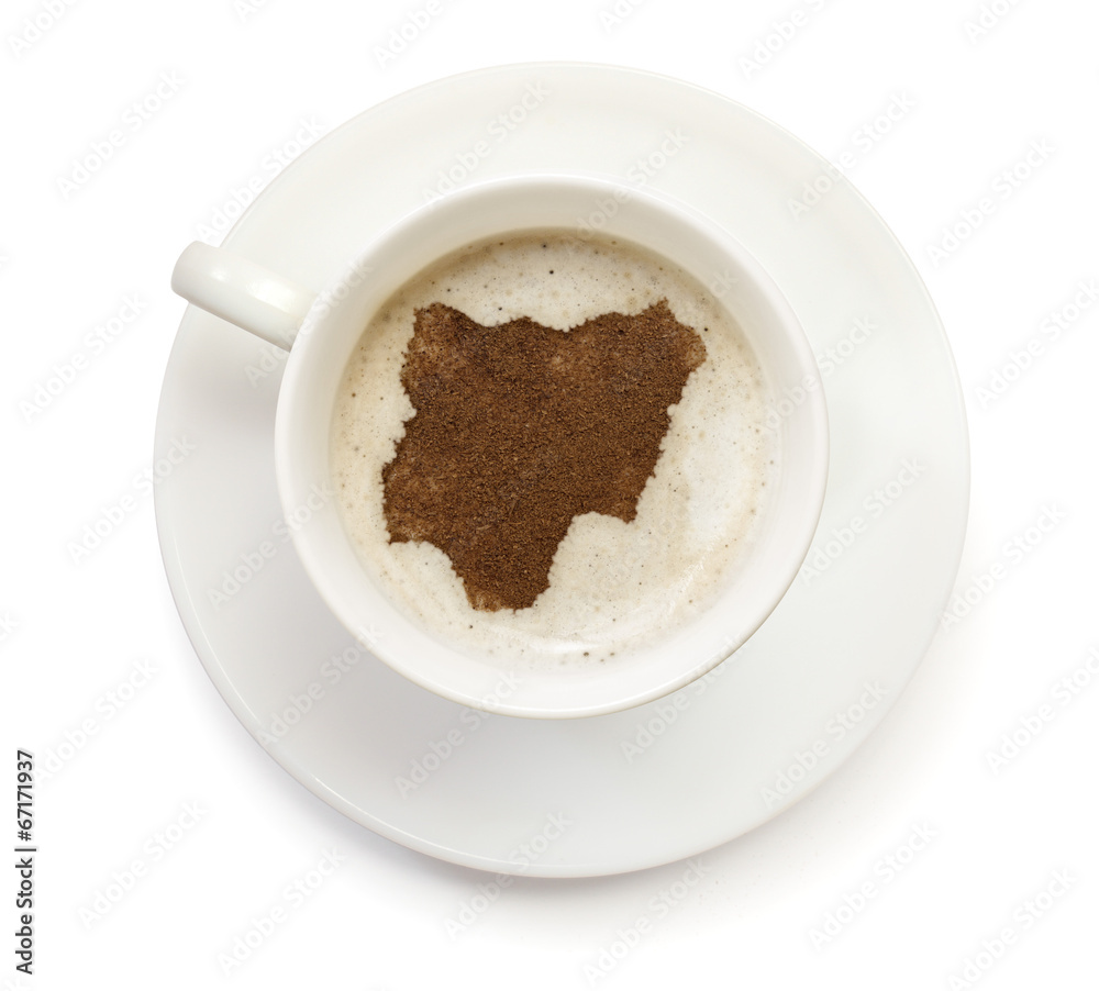 Cup of coffee with foam and powder in the shape of Nigeria.(seri Cup of coffee with foam and powder in the shape of Nigeria.(seri