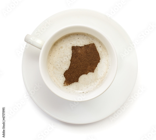 Cup of coffee with foam and powder in the shape of Uganda.(serie
