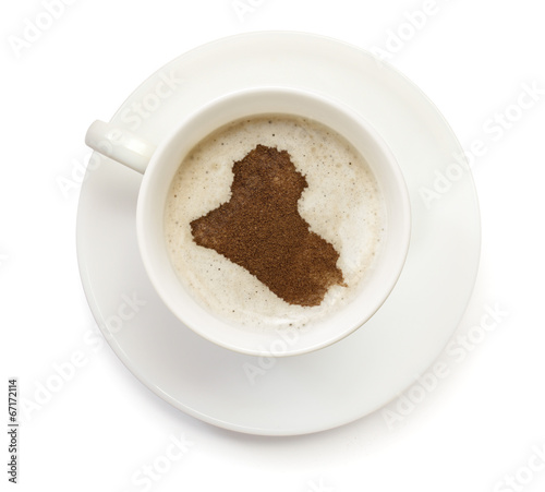 Cup of coffee with foam and powder in the shape of Iraq.(series)