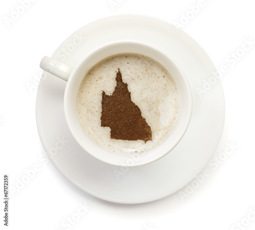 Cup of coffee with foam and powder in the shape of Queensland.(s