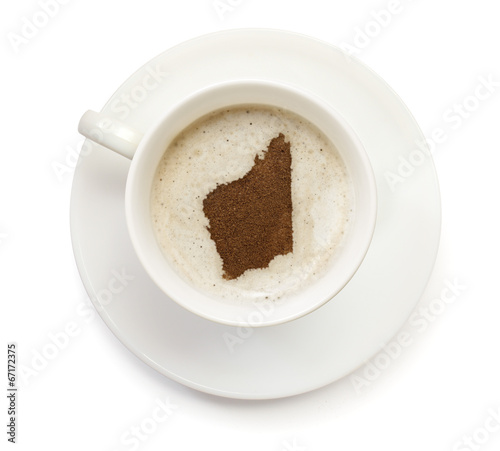 Cup of coffee with foam and powder in the shape of Western Austr