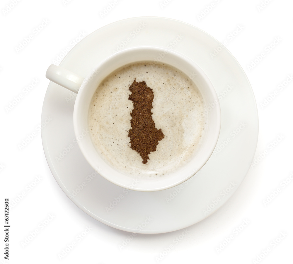 Cup of coffee with foam and powder in the shape of Albania.(seri Cup of coffee with foam and powder in the shape of Albania.(seri