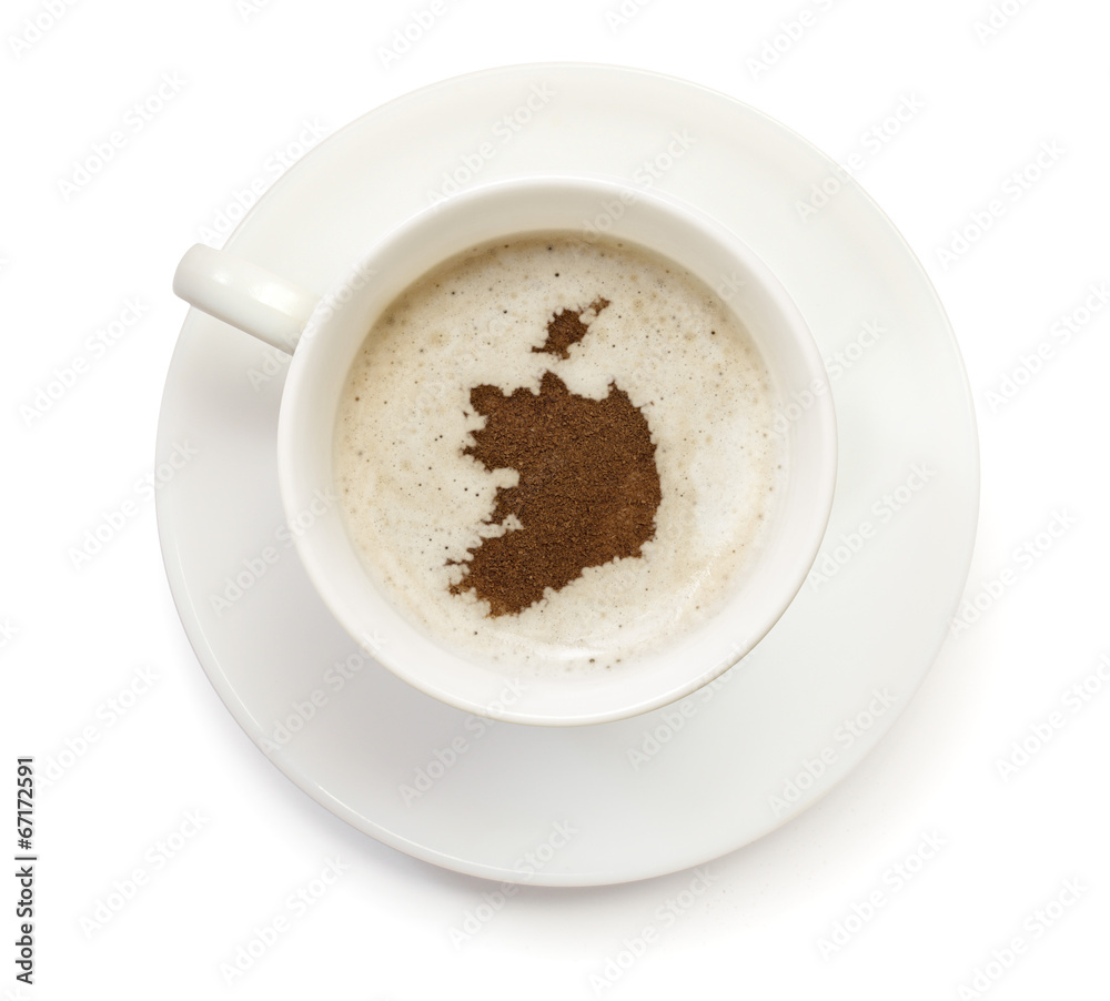 Cup of coffee with foam and powder in the shape of Ireland.(seri Cup of coffee with foam and powder in the shape of Ireland.(seri