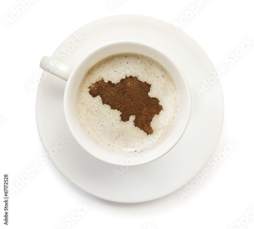 Cup of coffee with foam and powder in the shape of Belgium.(seri