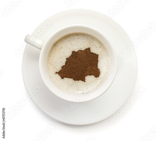 Cup of coffee with foam and powder in the shape of Vatican City.