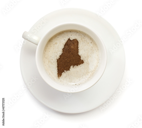 Cup of coffee with foam and powder in the shape of Maine.(series