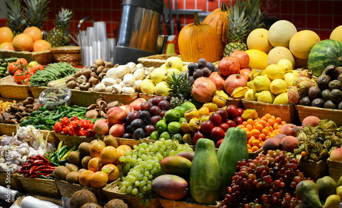 Fruit market with various colorful fresh fruits and vegetables -