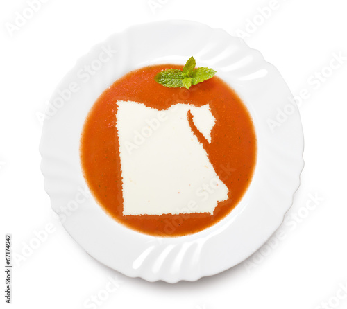 Plate tomato soup with cream in the shape of Egypt.(series)