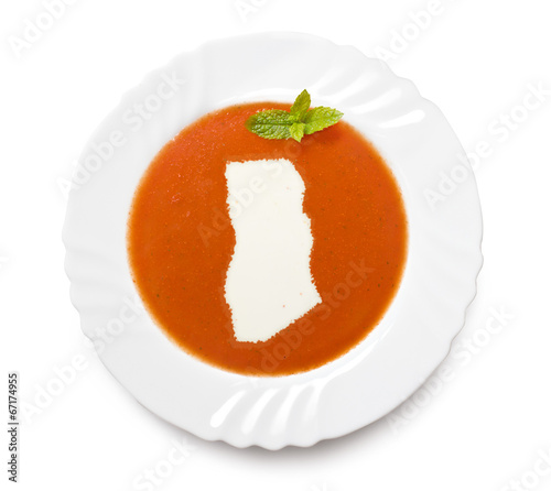 Plate tomato soup with cream in the shape of Ghana.(series)