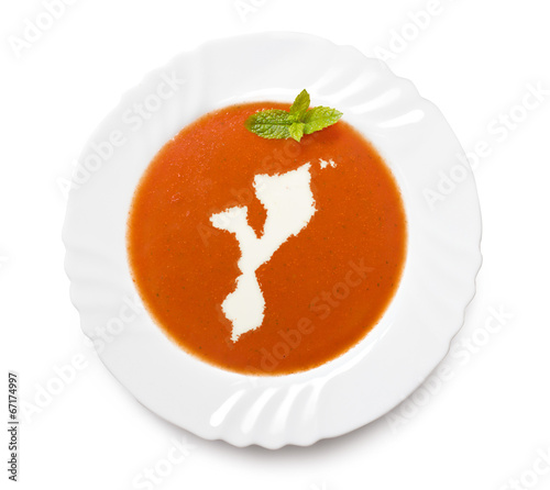 Plate tomato soup with cream in the shape of Mozambique.(series)