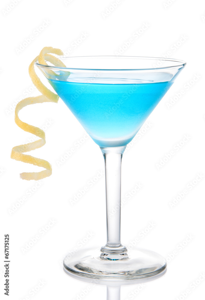 Blue tropical martini cocktail with yellow lemon spiral