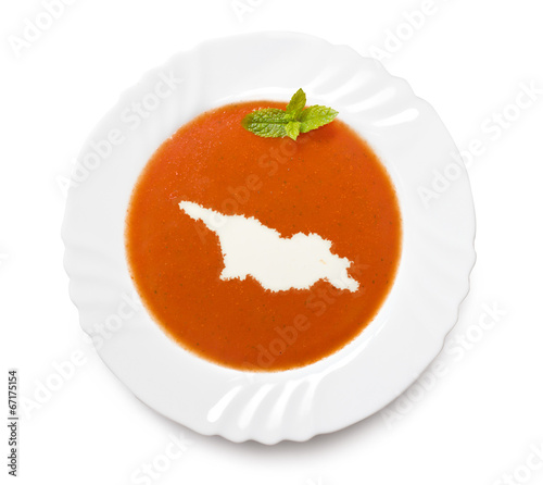 Plate tomato soup with cream in the shape of Georgia.(series)