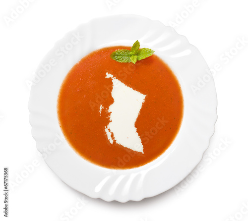 Plate tomato soup with cream in the shape of British Columbia.(s