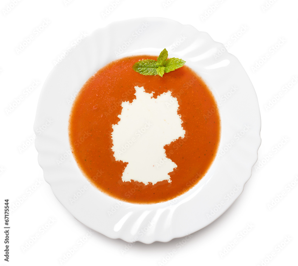 Plate tomato soup with cream in the shape of Germany.(series) Plate tomato soup with cream in the shape of Germany.(series)