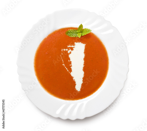 Plate tomato soup with cream in the shape of Gibraltar.(series) photo