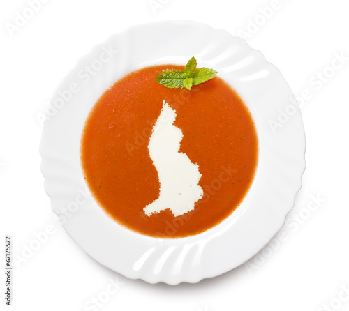 Plate tomato soup with cream in the shape of Lichtenstein.(serie photo