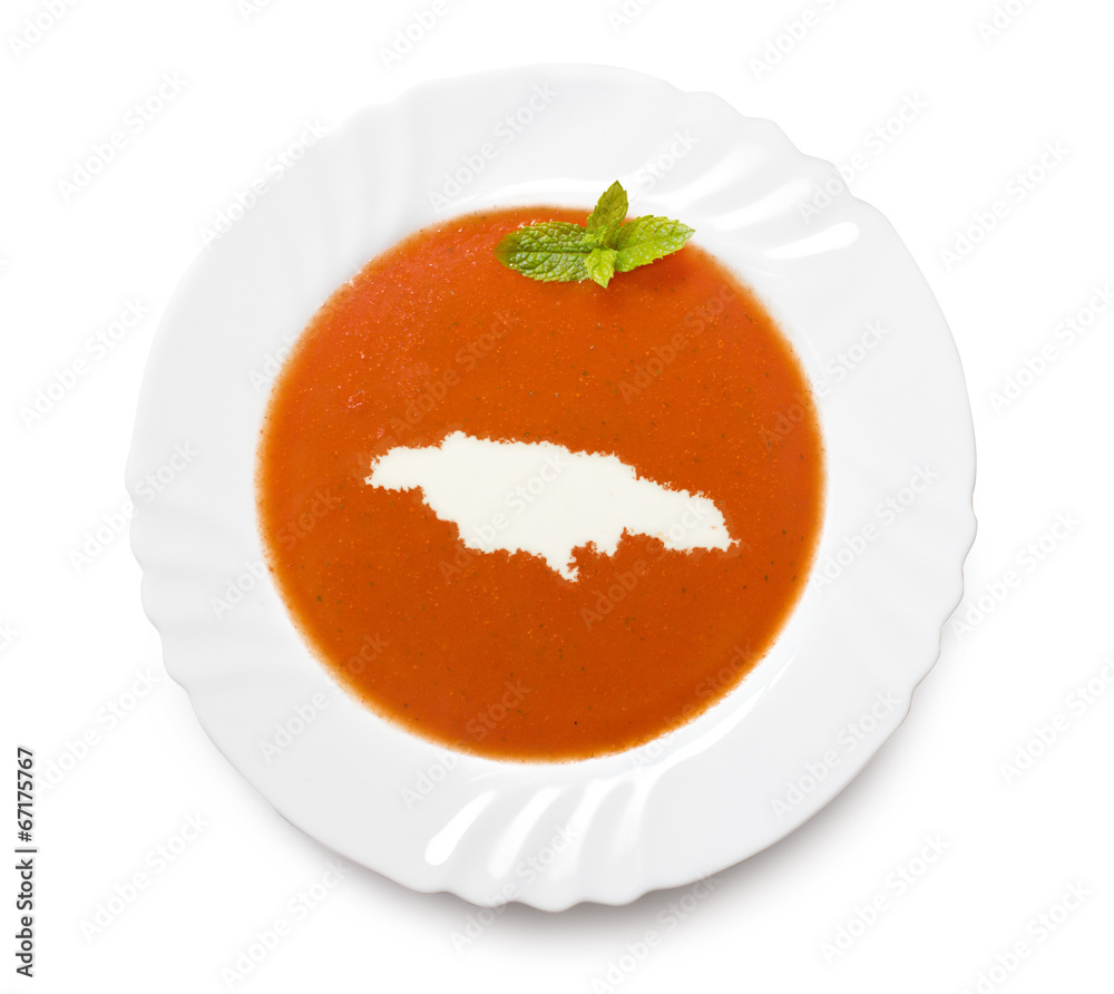 Plate tomato soup with cream in the shape of Jamaica.(series)