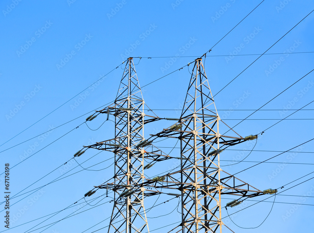 Electric lines pylon on blue sky background