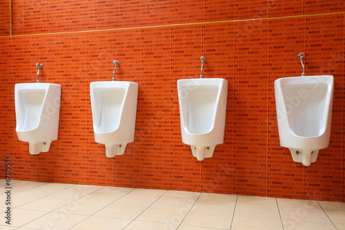 White porcelain urinals in gents toilets