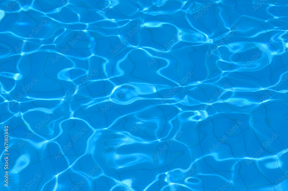 Hotel swimming pool with sunny reflections