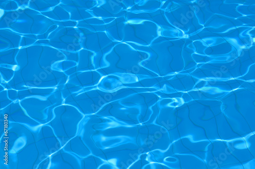 Hotel swimming pool with sunny reflections