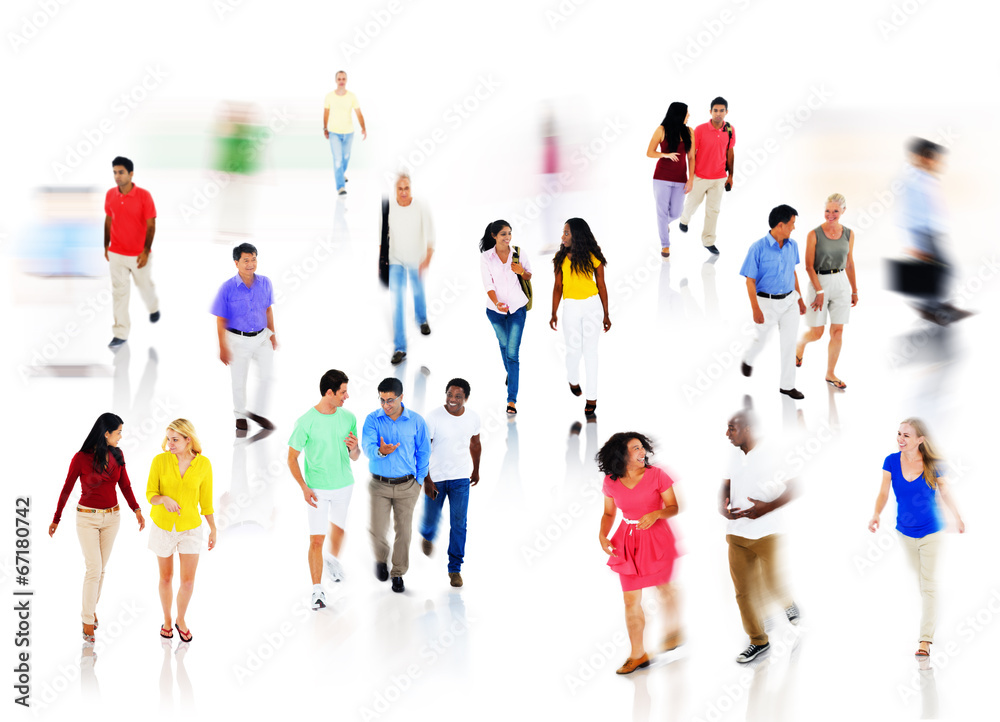 Multi-Ethnic Group of People Walking in Blurred Motion Multi-Ethnic Group of People Walking in Blurred Motion