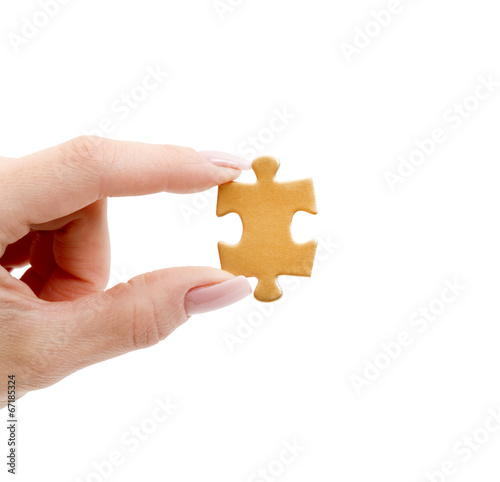 puzzle in hand isolated on white