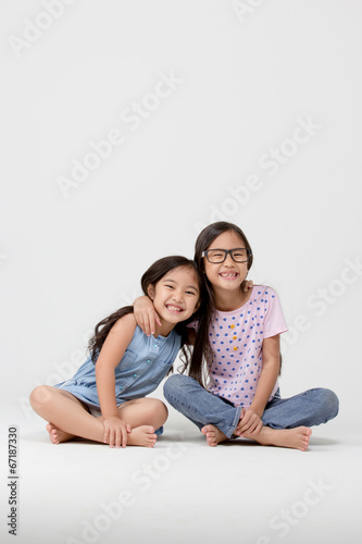Portrait of little cute Asian girl on isolated background © RedcupStudio